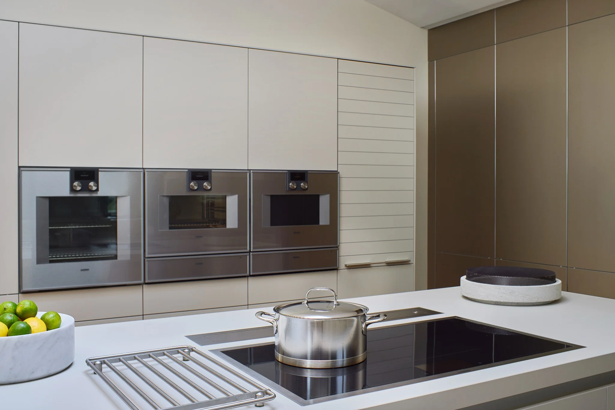 Gaggenau appliances in a minimalist luxury kitchen with integrated cabinetry
